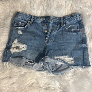 TopShop Moto Ashley denim jean shorts. Ripped details, button-up, size 2.